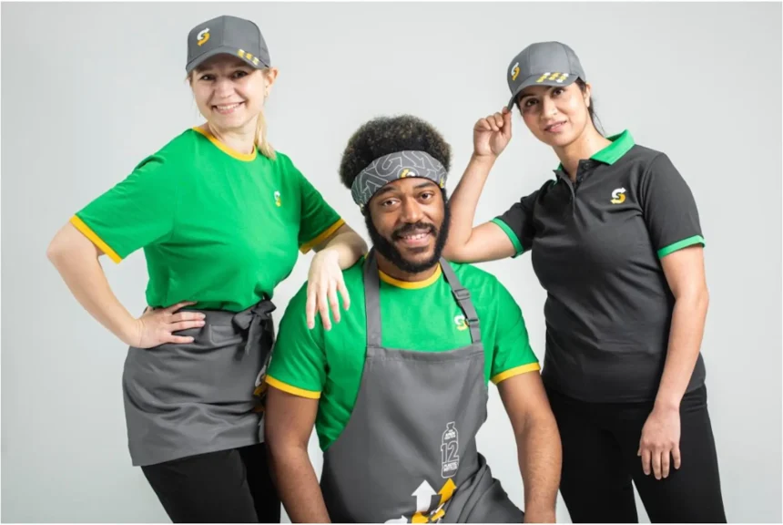 a subway team showing the sustainable subway uniforms